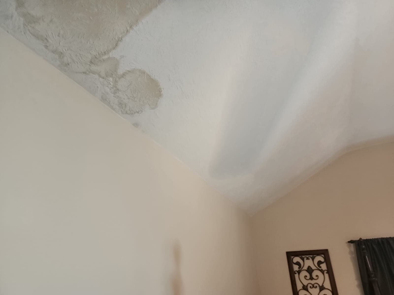 Mitigating water damage after pipe burst in attic.