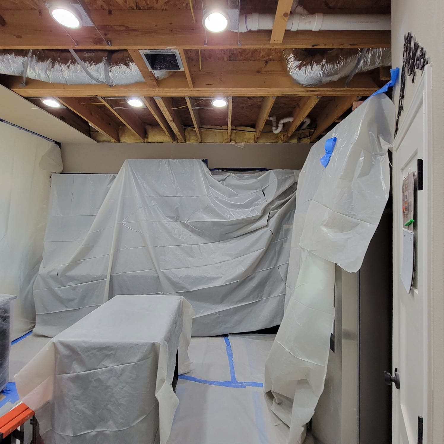 AC drainage leak that flooded the upstairs bathroom and downstairs kitchen. We set up containments, ran dehumidifiers and used air scrubbers while we removed contaminated materials.