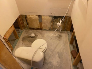 Drying out property after flood caused by a drainage system problem where a collapsed pipe caused the toilet to overflow.