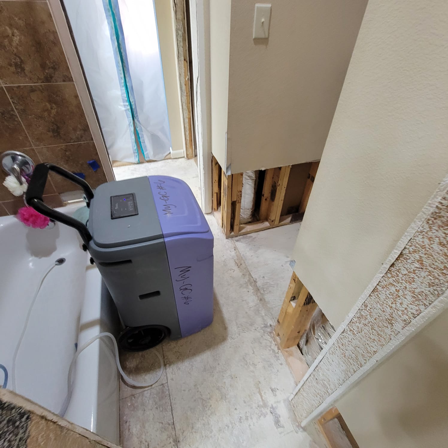 AC drainage leak that flooded the upstairs bathroom and downstairs kitchen. We set up containments, ran dehumidifiers and used air scrubbers while we removed contaminated materials.