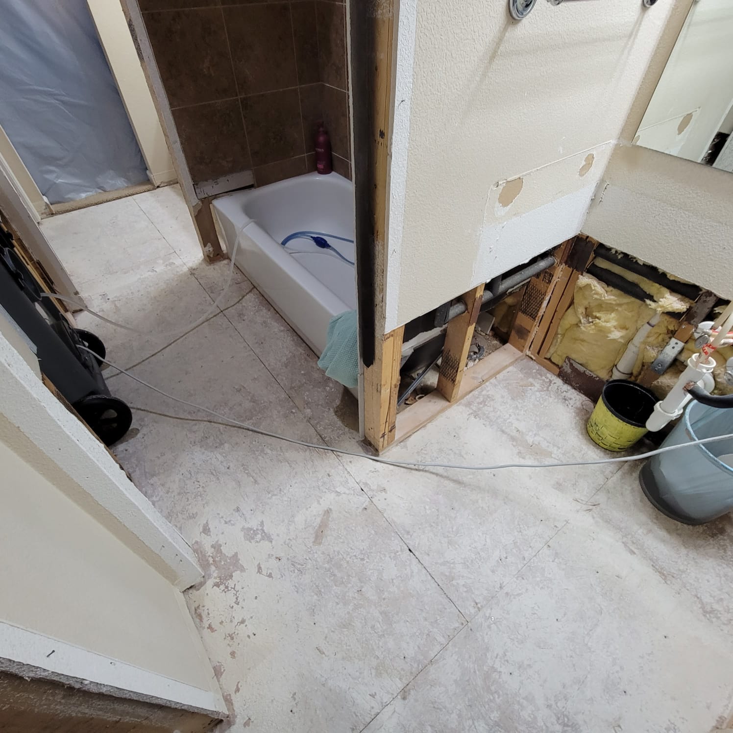 AC drainage leak that flooded the upstairs bathroom and downstairs kitchen. We set up containments, ran dehumidifiers and used air scrubbers while we removed contaminated materials.