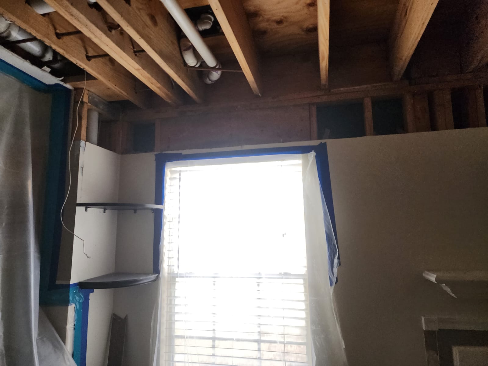 Water damage restoration after upstairs bathroom leak.