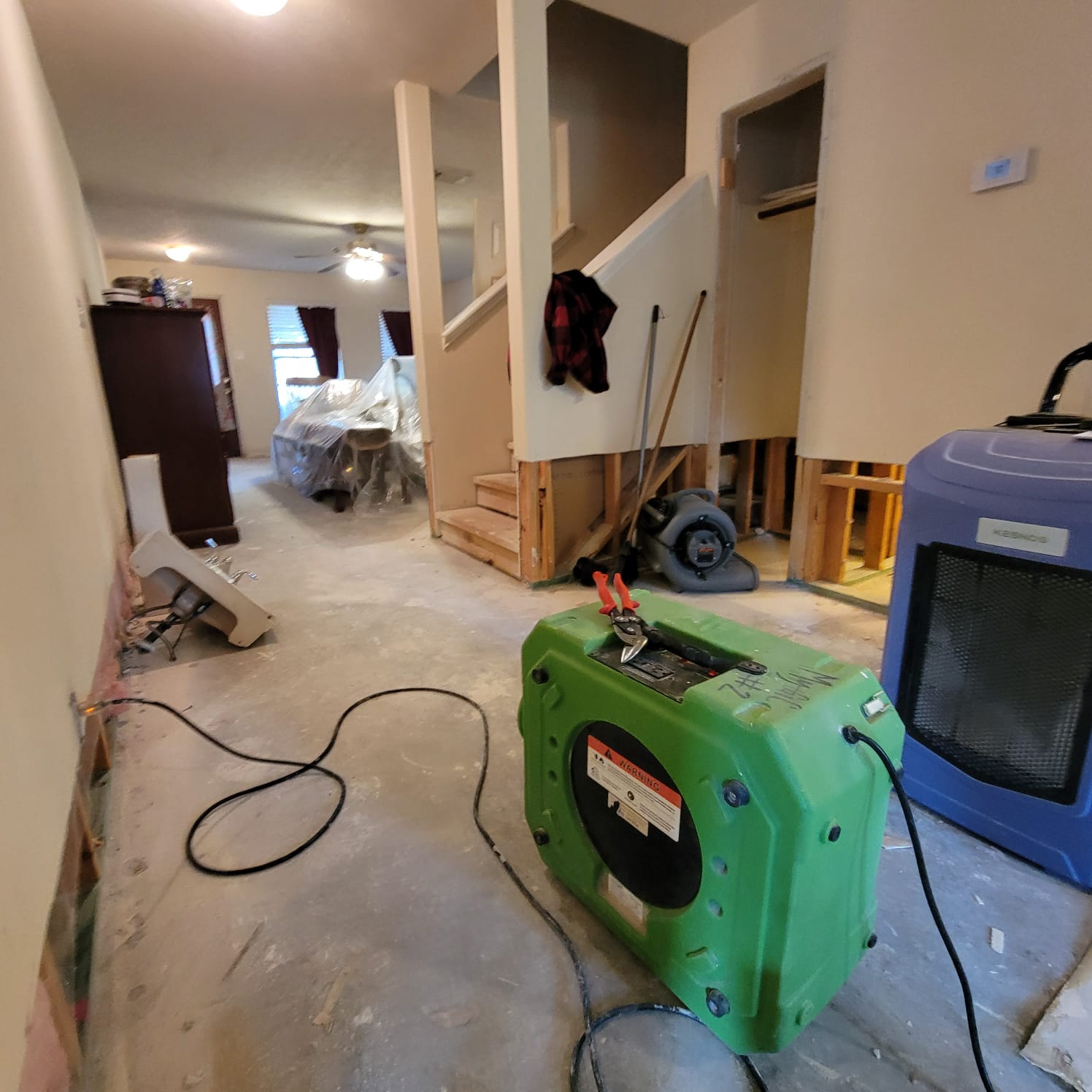 Drying out property after flood caused by a drainage system problem where a collapsed pipe caused the toilet to overflow.