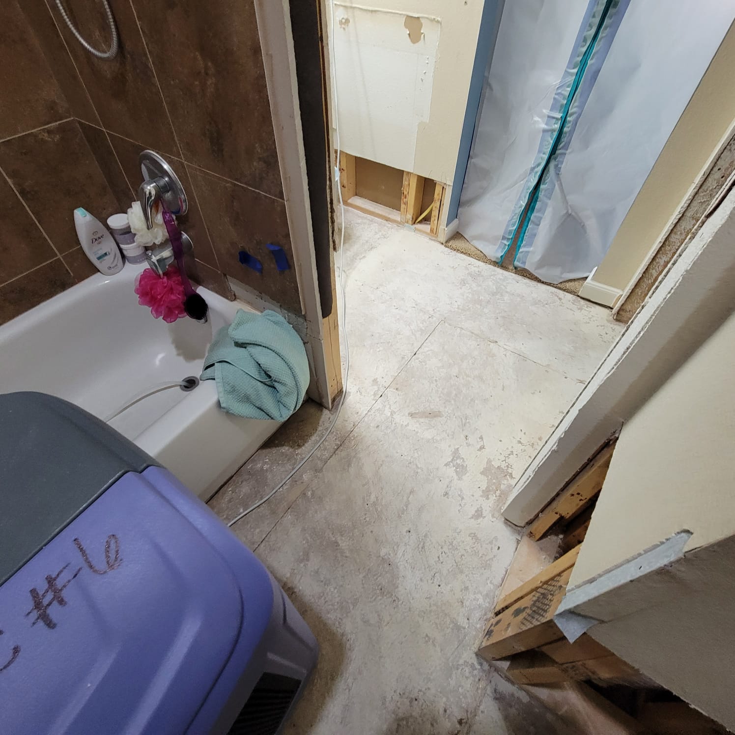 AC drainage leak that flooded the upstairs bathroom and downstairs kitchen. We set up containments, ran dehumidifiers and used air scrubbers while we removed contaminated materials.