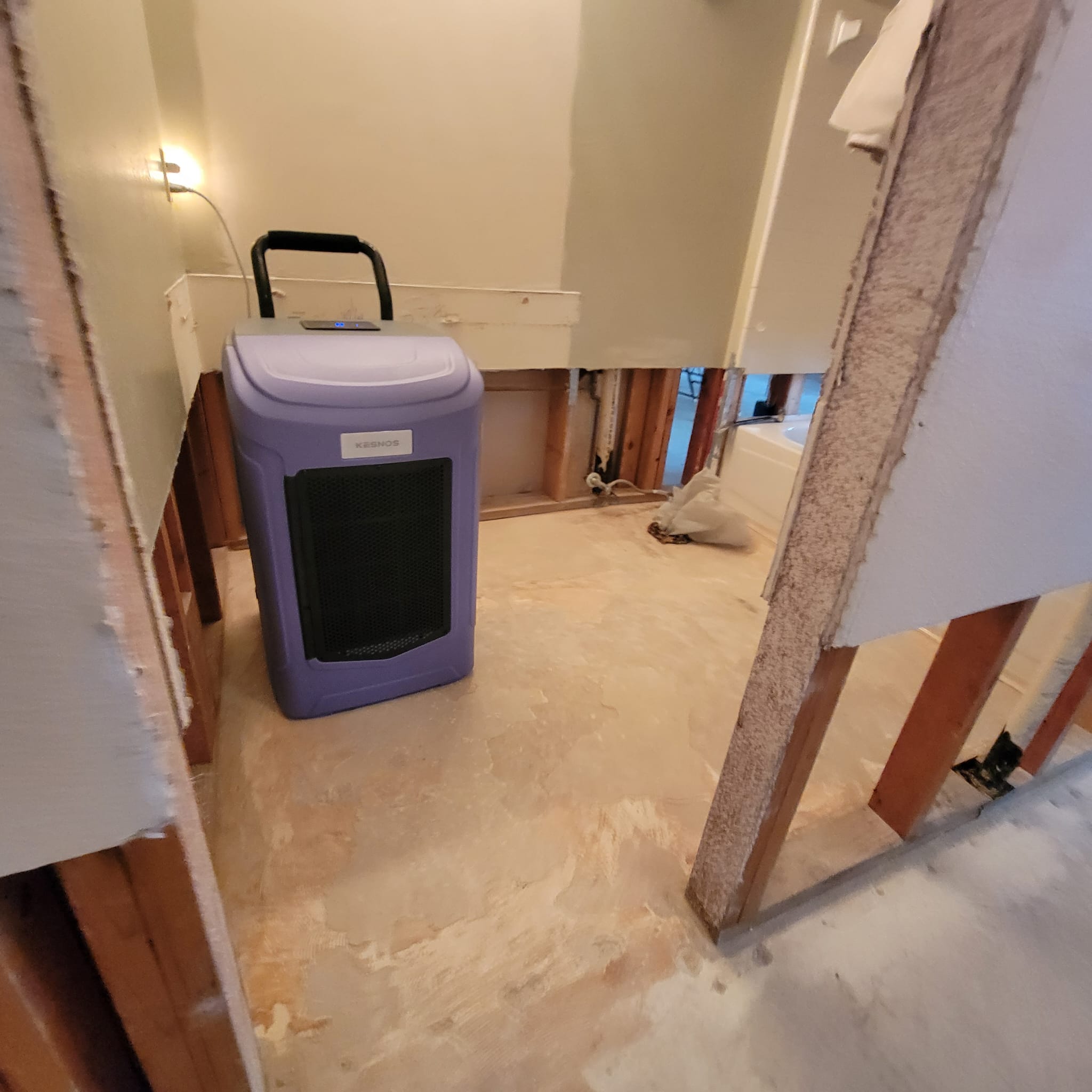 Water damage restoration after a toilet tank busted and flooded this Houston, TX house