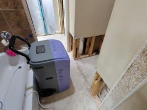 AC drainage leak that flooded the upstairs bathroom and downstairs kitchen. We set up containments, ran dehumidifiers and used air scrubbers while we removed contaminated materials.