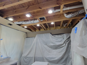 AC drainage leak that flooded the upstairs bathroom and downstairs kitchen. We set up containments, ran dehumidifiers and used air scrubbers while we removed contaminated materials.