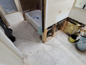 AC drainage leak that flooded the upstairs bathroom and downstairs kitchen. We set up containments, ran dehumidifiers and used air scrubbers while we removed contaminated materials.