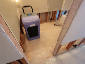 Water damage restoration after a toilet tank busted and flooded this Houston, TX house