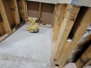AC drainage leak that flooded the upstairs bathroom and downstairs kitchen. We set up containments, ran dehumidifiers and used air scrubbers while we removed contaminated materials.