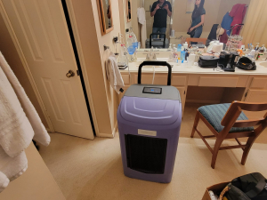 Water damage restoration after a toilet tank busted and flooded this Houston, TX house