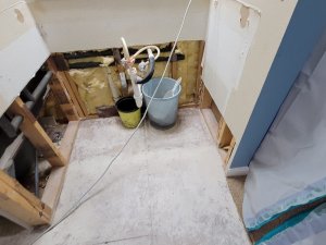 AC drainage leak that flooded the upstairs bathroom and downstairs kitchen. We set up containments, ran dehumidifiers and used air scrubbers while we removed contaminated materials.