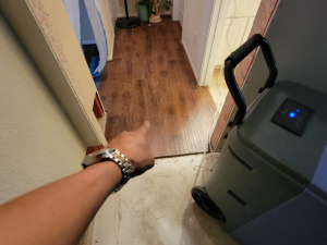 We extracted the water, dried out the home, and cut out and replaced the damaged materials after a washer overflowed.
