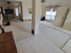 Water damage restoration after a toilet tank busted and flooded this Houston, TX house