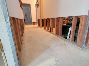 Water damage restoration after a toilet tank busted and flooded this Houston, TX house