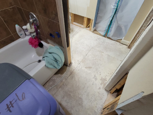 AC drainage leak that flooded the upstairs bathroom and downstairs kitchen. We set up containments, ran dehumidifiers and used air scrubbers while we removed contaminated materials.
