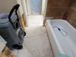 AC drainage leak that flooded the upstairs bathroom and downstairs kitchen. We set up containments, ran dehumidifiers and used air scrubbers while we removed contaminated materials.