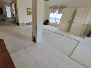 Water damage restoration after a toilet tank busted and flooded this Houston, TX house