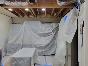 AC drainage leak that flooded the upstairs bathroom and downstairs kitchen. We set up containments, ran dehumidifiers and used air scrubbers while we removed contaminated materials.