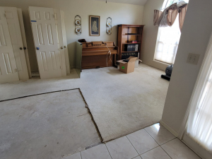 Water damage restoration after a toilet tank busted and flooded this Houston, TX house